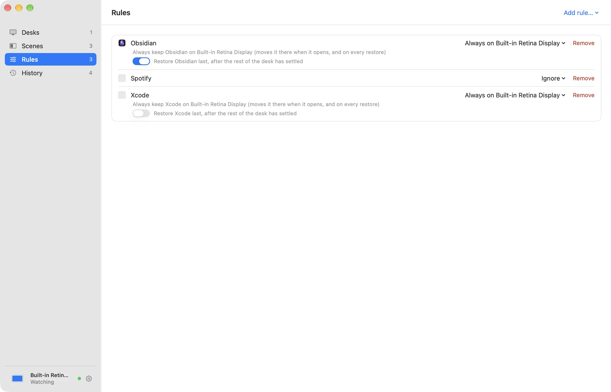 The Rules tab: Obsidian always on the built-in display and restored last, Spotify ignored, Xcode always on the built-in display